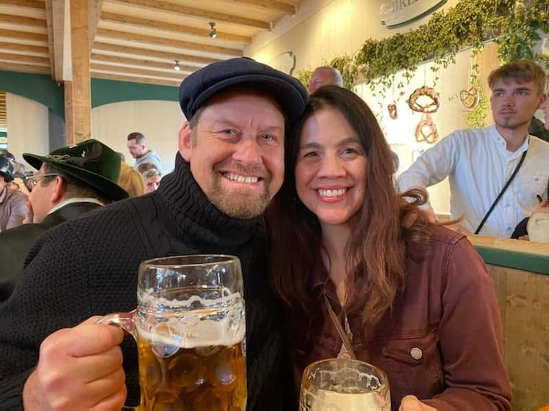 Brice and Sherry raising steins — Oktoberfest beer hall