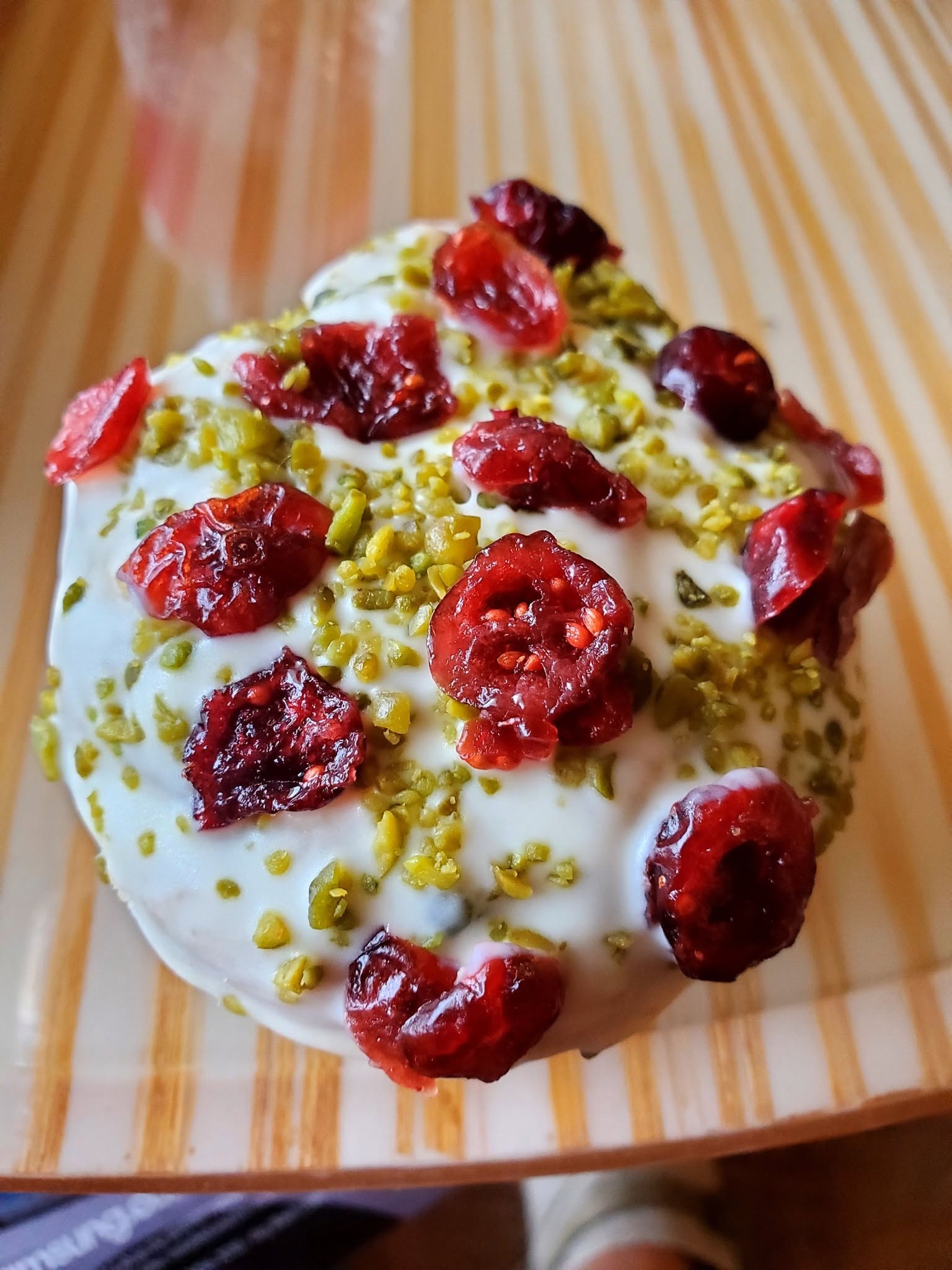 Creamy dessert with raspberries and pistachios — Thailand, Sept 10
