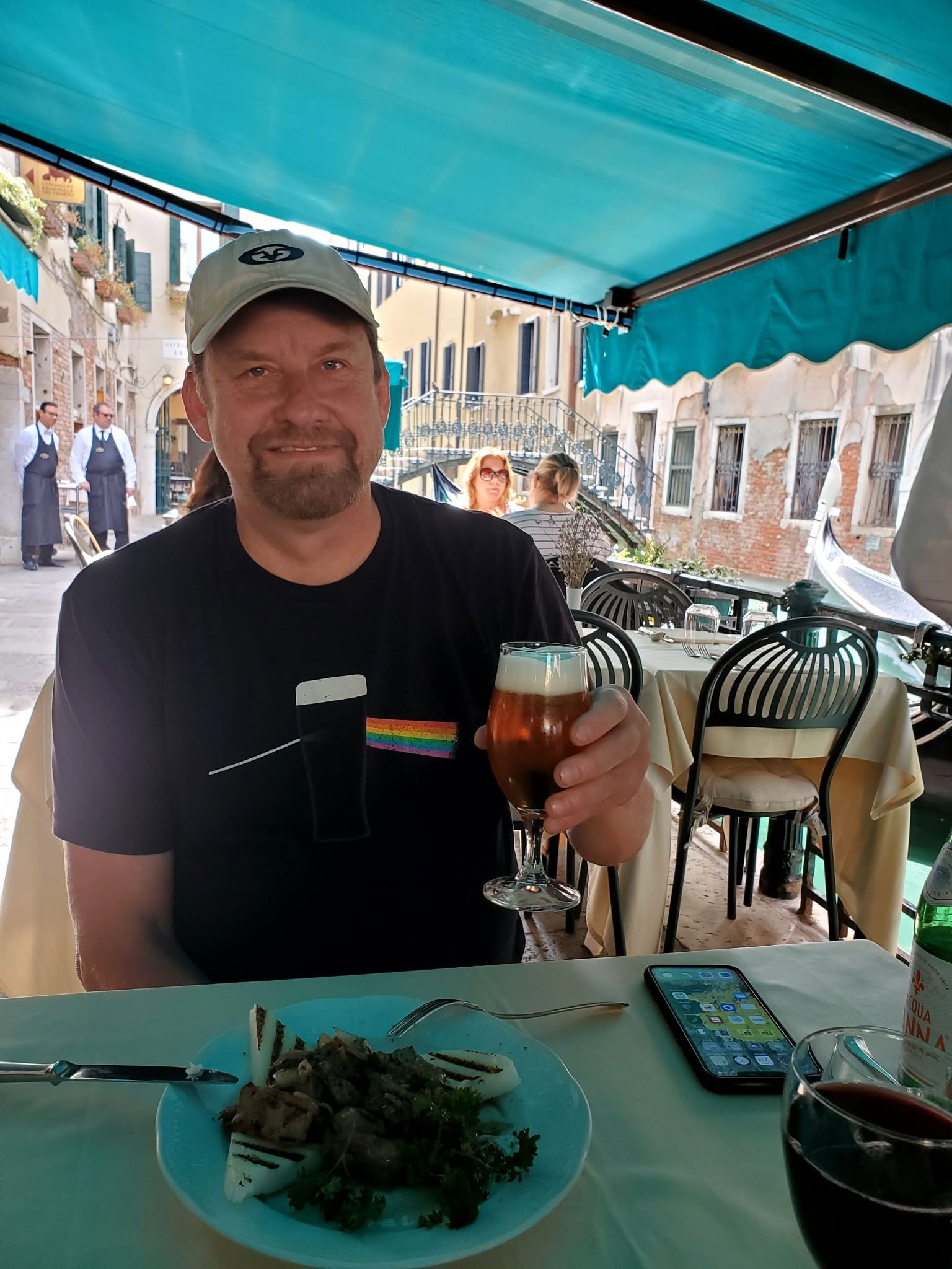 Brice enjoying a drink at an outdoor Thailand café