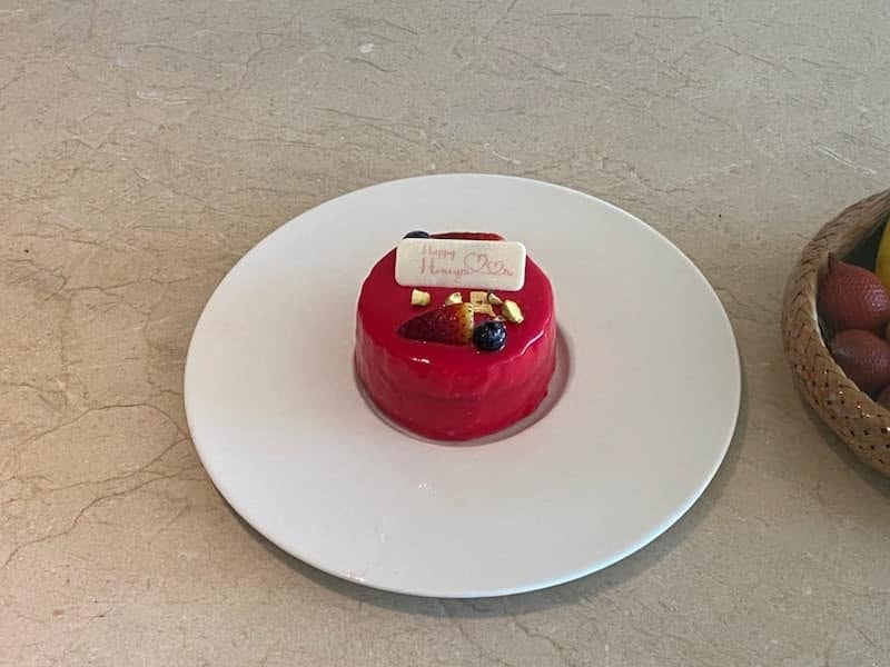 Honeymoon cake — red glazed dessert with berries, Thailand