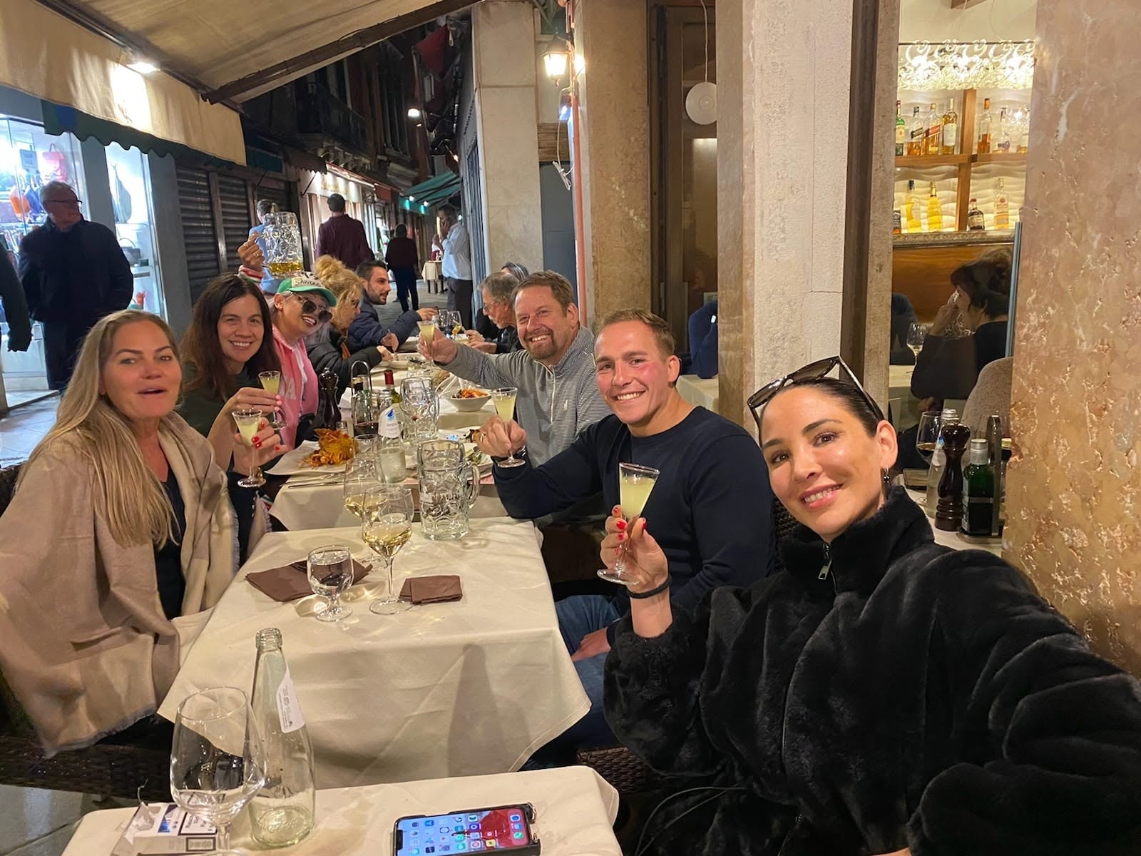 Group dinner on an outdoor restaurant terrace — Venice