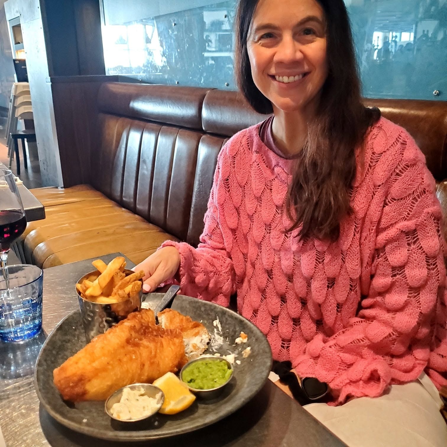 Sherry enjoying fish and chips — a British pub find in Thailand